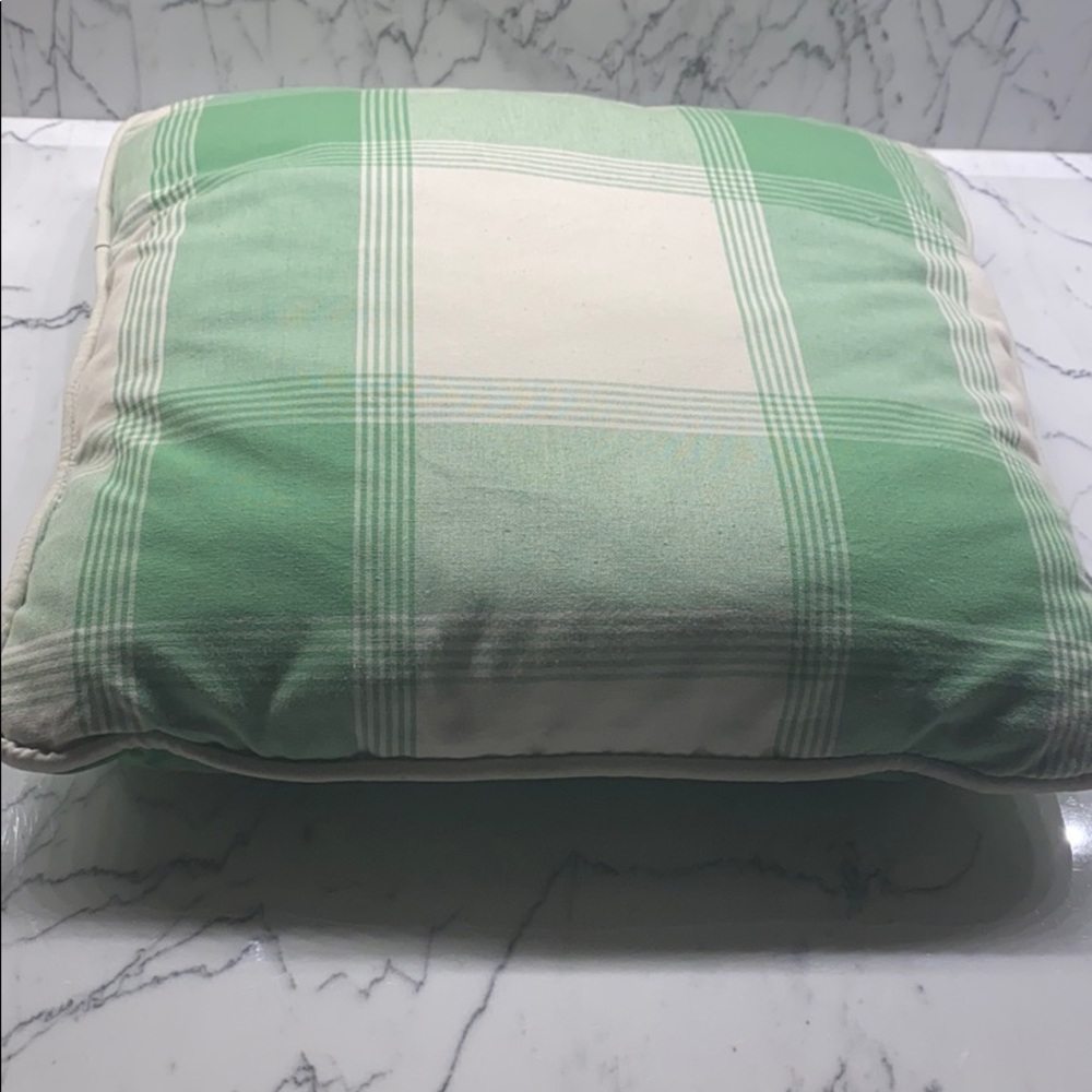 Green and cream throw pillow